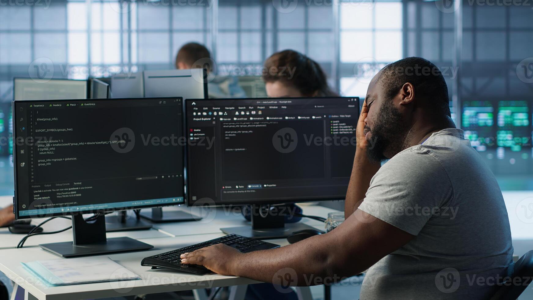 System admin feeling ill, having fever while working in computer network security data center. Sick worker suffering headache while monitoring energy consumption across server racks, camera A photo