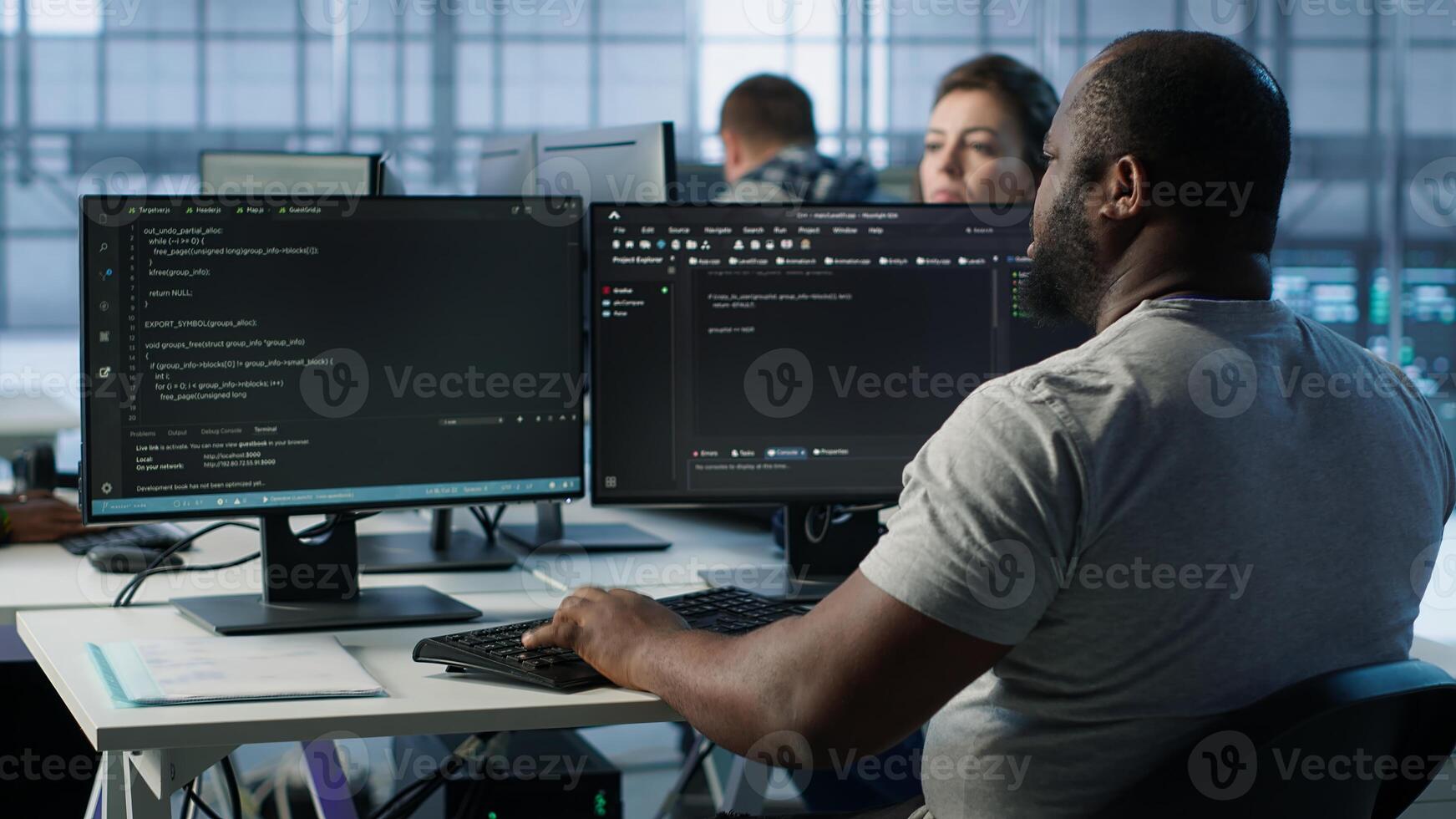 Admin programming in server room housing advanced equipment storing massive datasets. Developer typing code on PC to mend data center racks doing complex computational operations, camera A photo