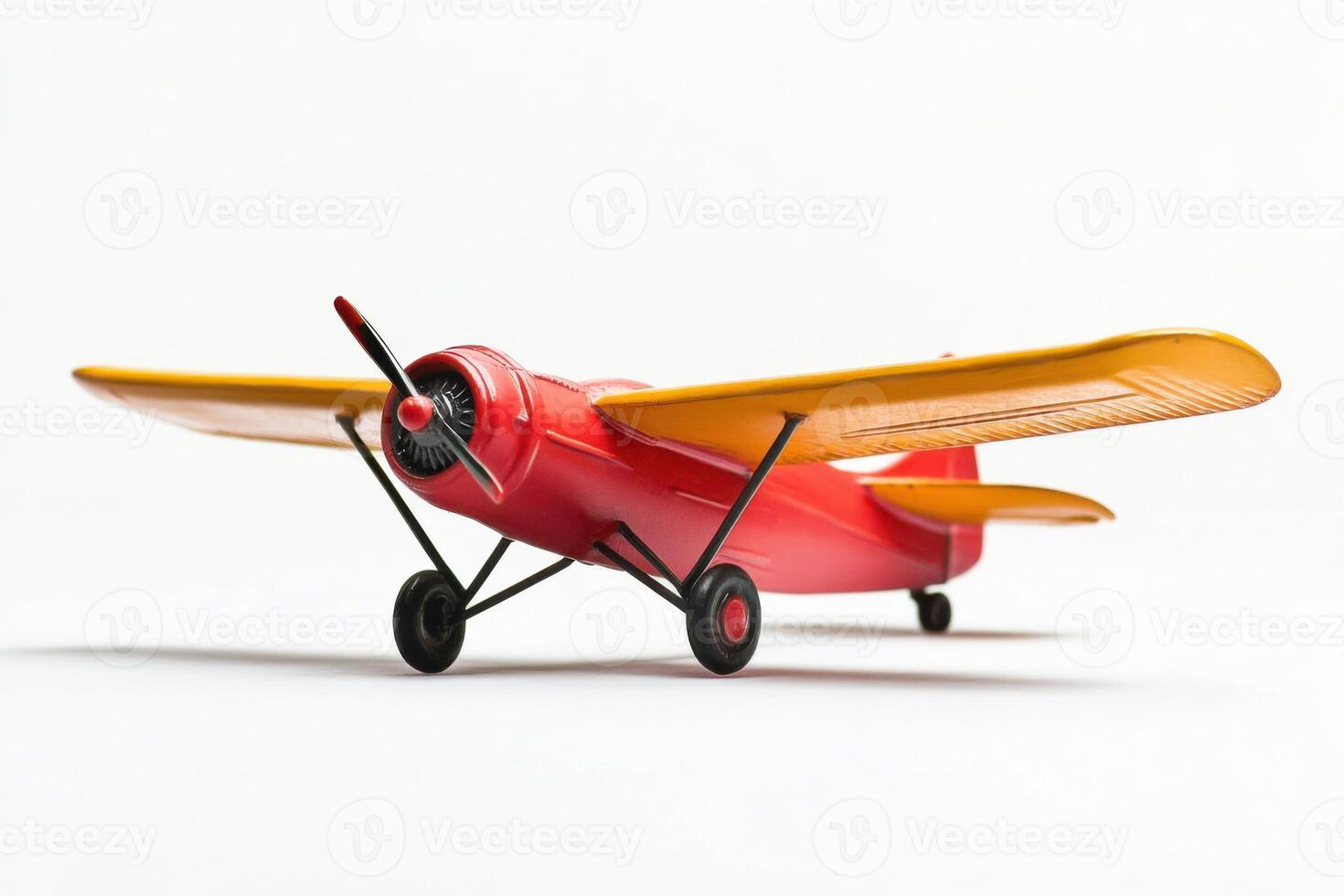 Realistic toy airplane in bright colors on a clean white background for creative use photo