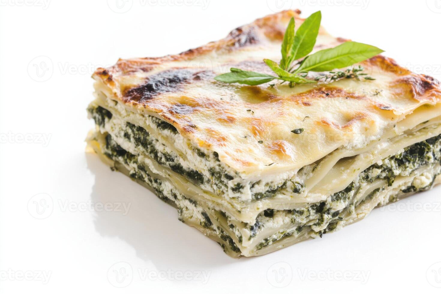 Indulge in a delicious slice of classic lasagna with rich layers and fresh herbs complementing the dish photo