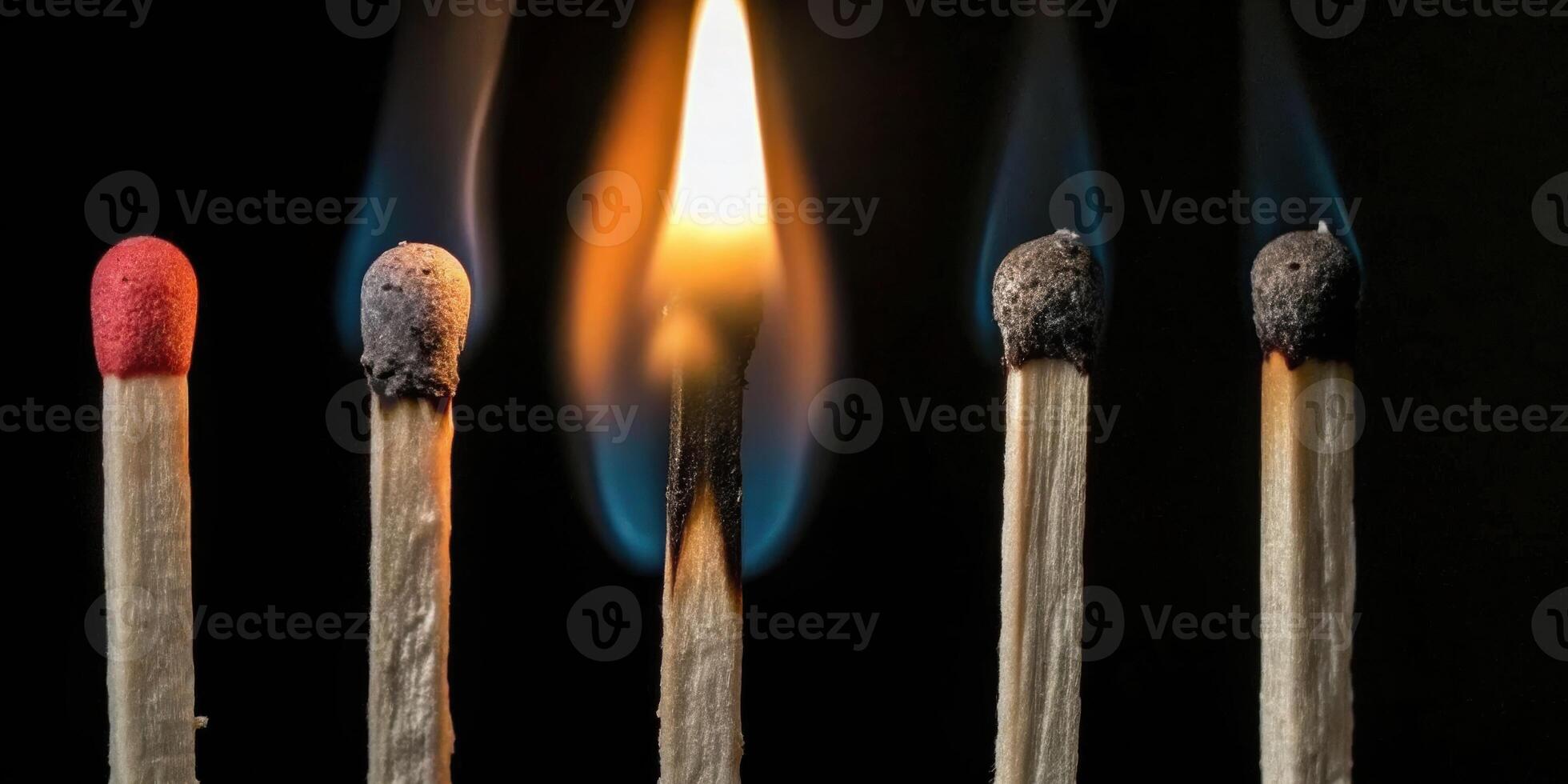 Pin igniting fire from matchstick set isolated on black background capturing the moment of burn photo