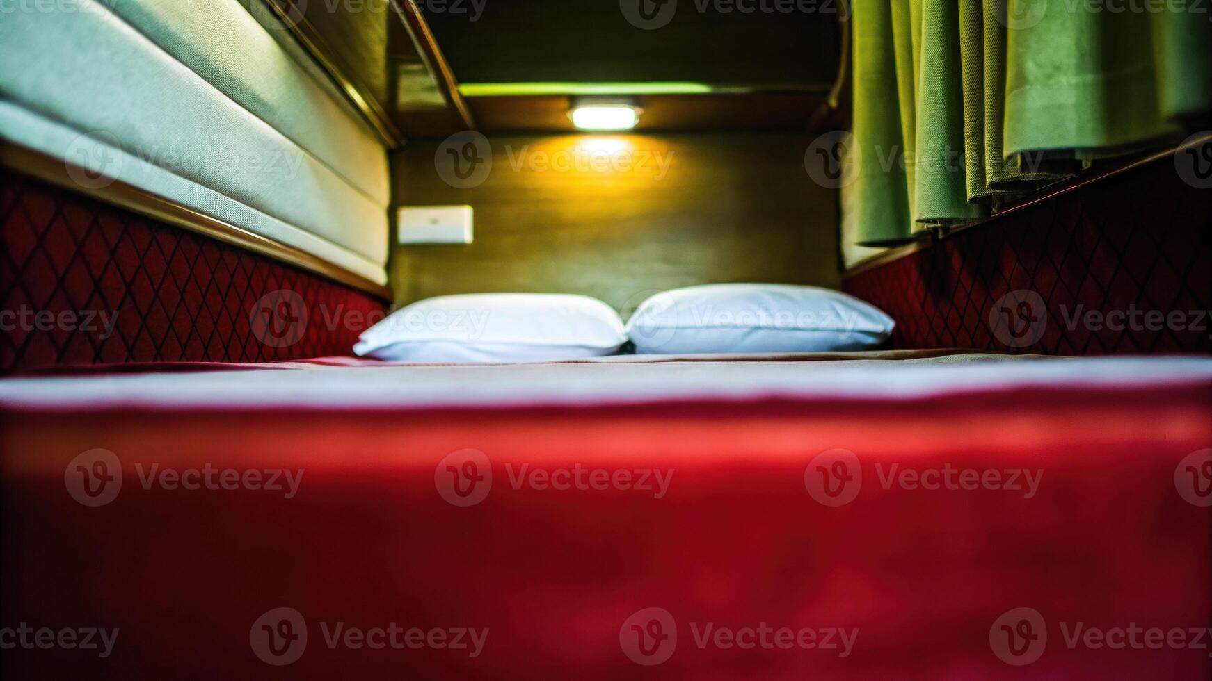 Inside an old sleeper train room featuring a single neatly made bed with warm lighting photo