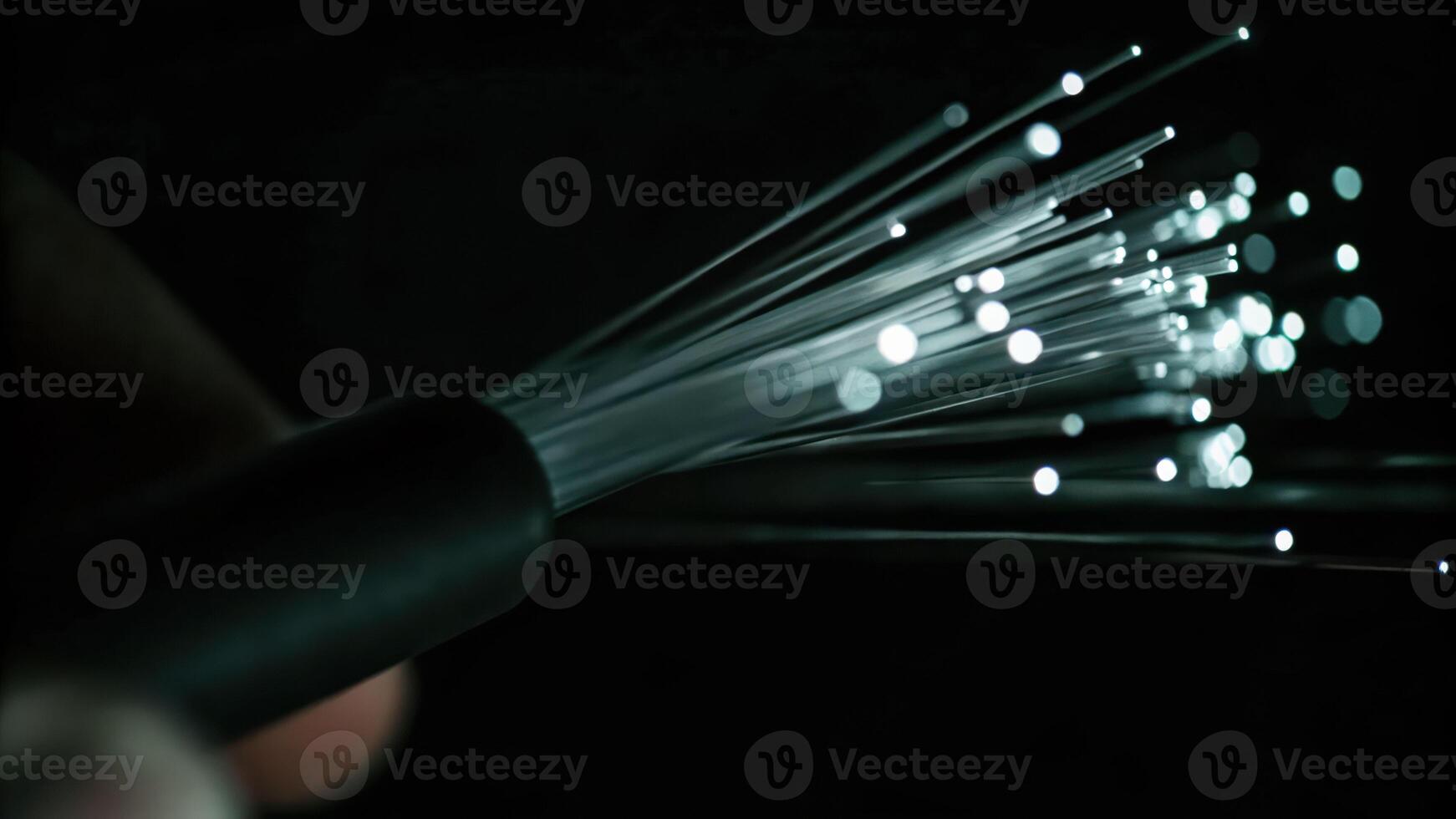 Cyber finger focus on fiber optic node illuminated light pulses with binary code macro view technology environment photo