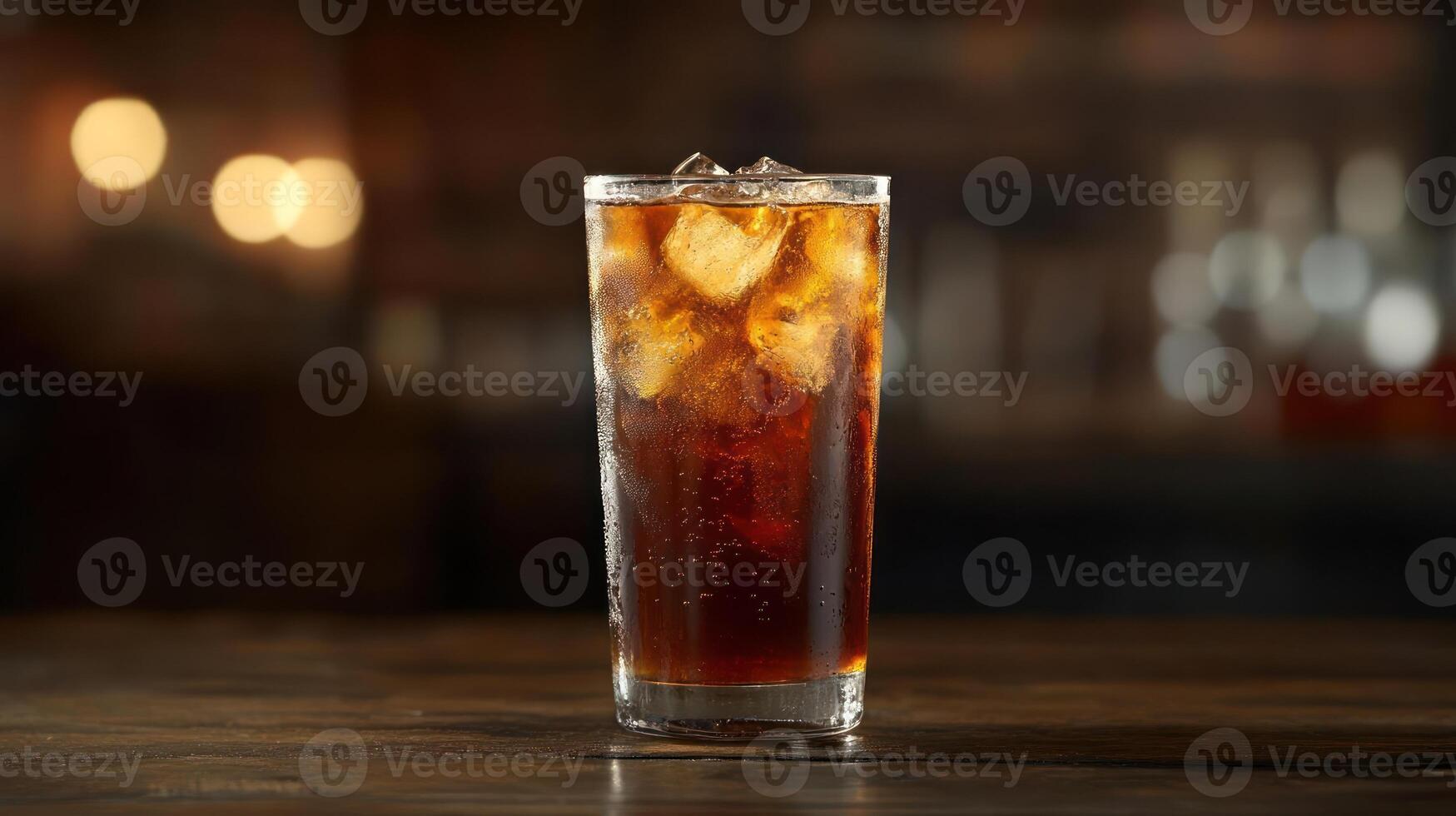 Refreshing cola drink with ice in a tall glass. photo