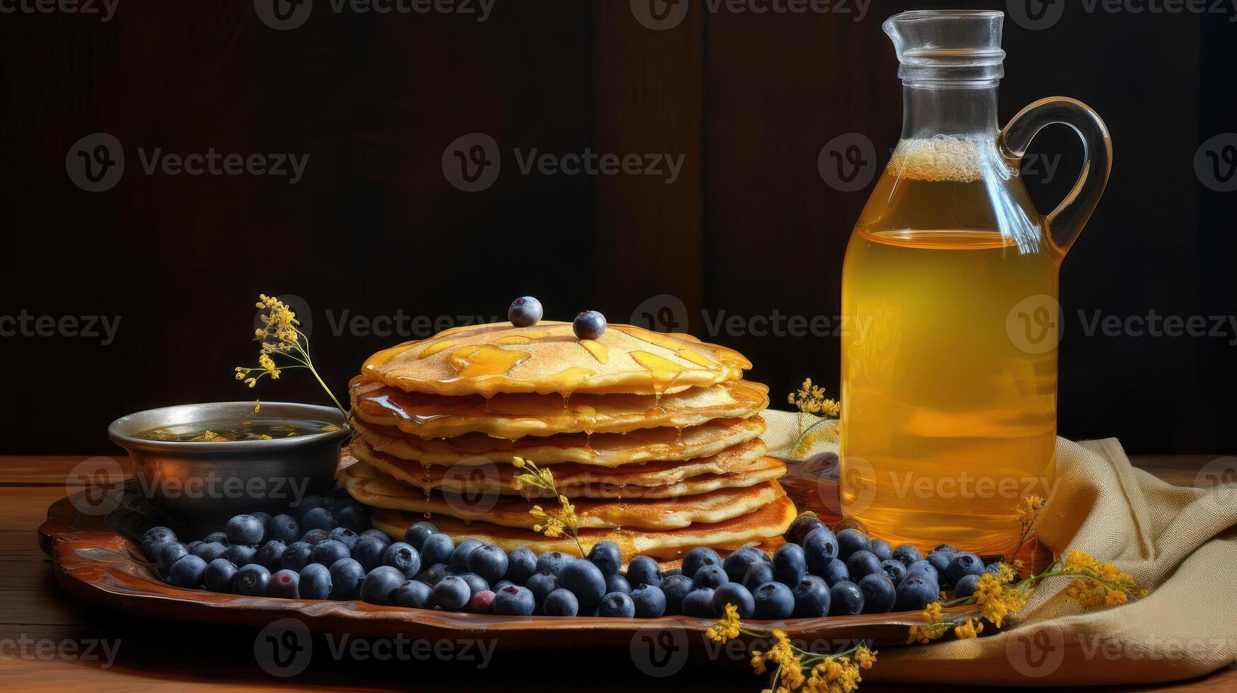 Stack of pancakes with blueberries and syrup on a wooden platter. photo