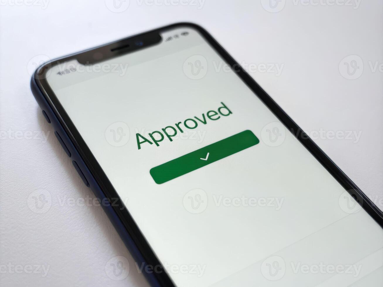 Digital card approval alert on mobile phone screen in clean environment showcasing modern technology photo