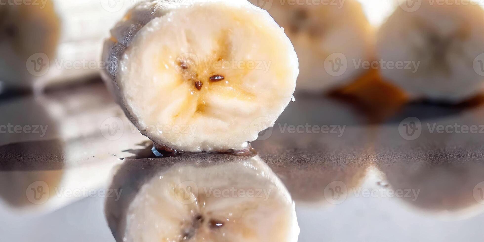 Captivating macro shot of oil being poured on banana slice glossy reflection kitchen setting culinary art photo