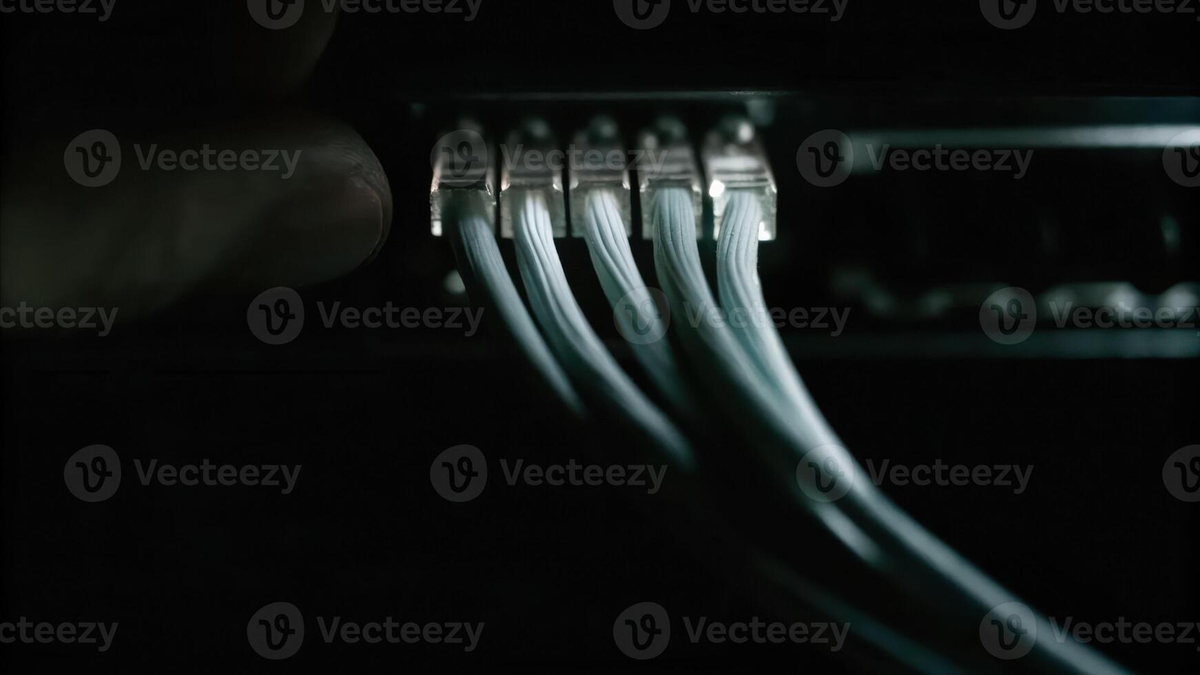 Cyber finger focus on fiber optic node high-tech environment macro image with light pulses and binary code photo