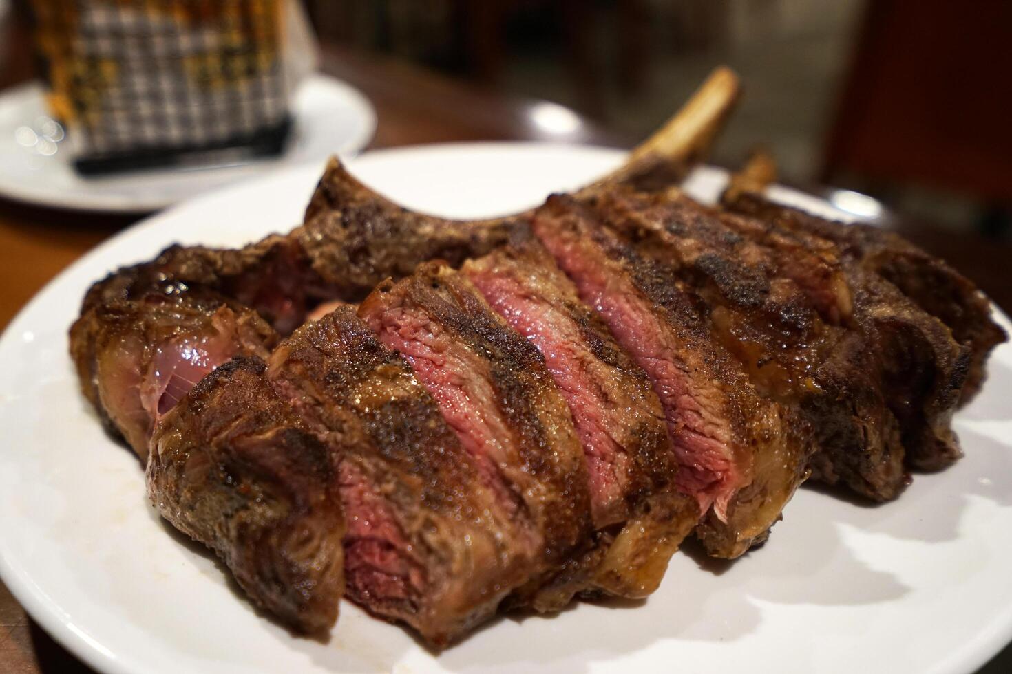 Close up medium rare T bone steak photo