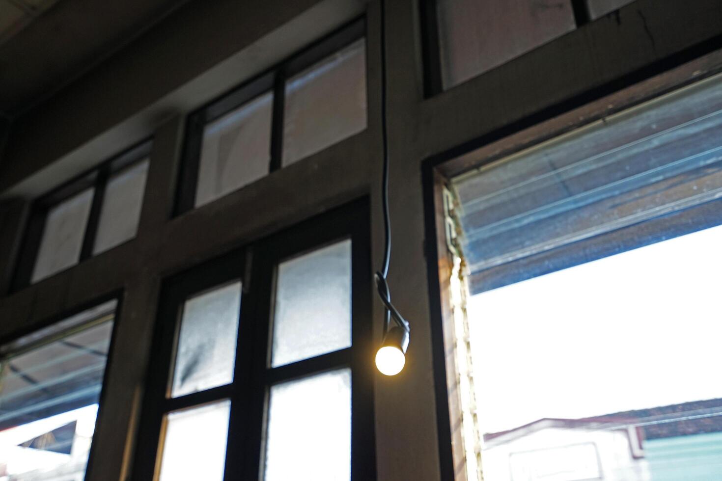 Interior architecture and ceiling design of industrial loft building decorated with modern electric light bulb in concrete cement structure photo