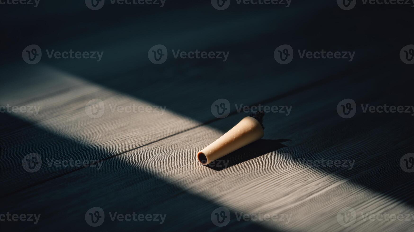Natural Light Illuminates Wooden Object on Dark Surface, Creating an Atmospheric and Minimalist Visual Composition photo