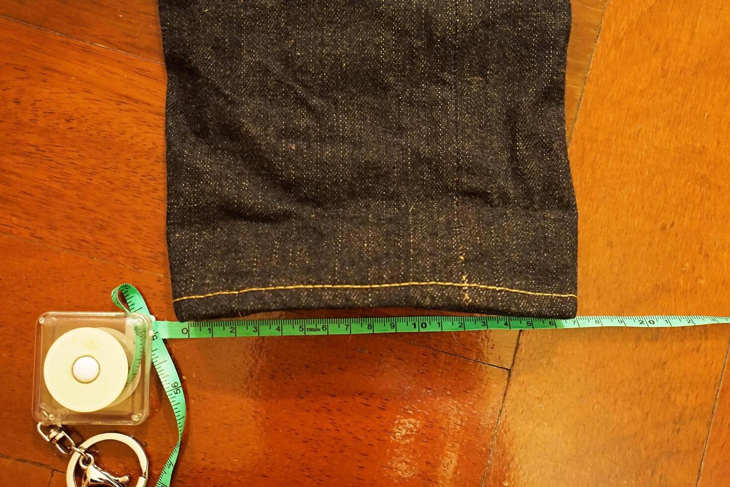 Measuring pair of Indigo denim Jeans pants photo