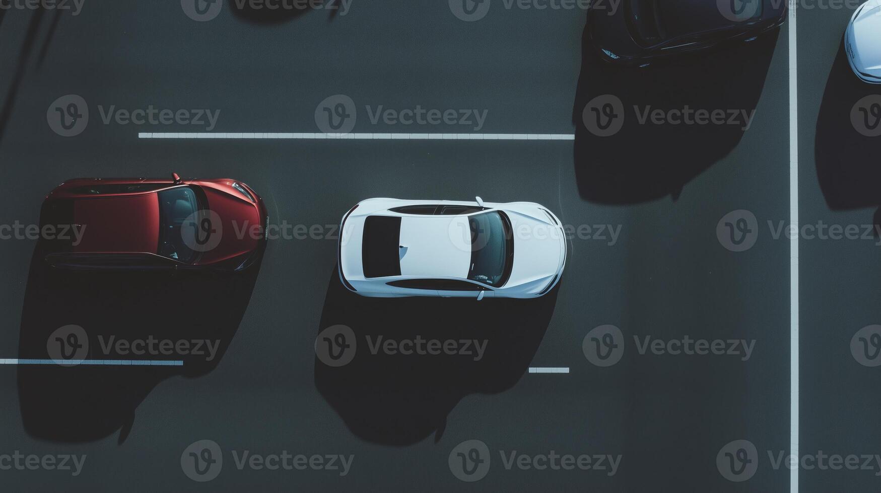 An overhead view of cars parked in a parking lot photo