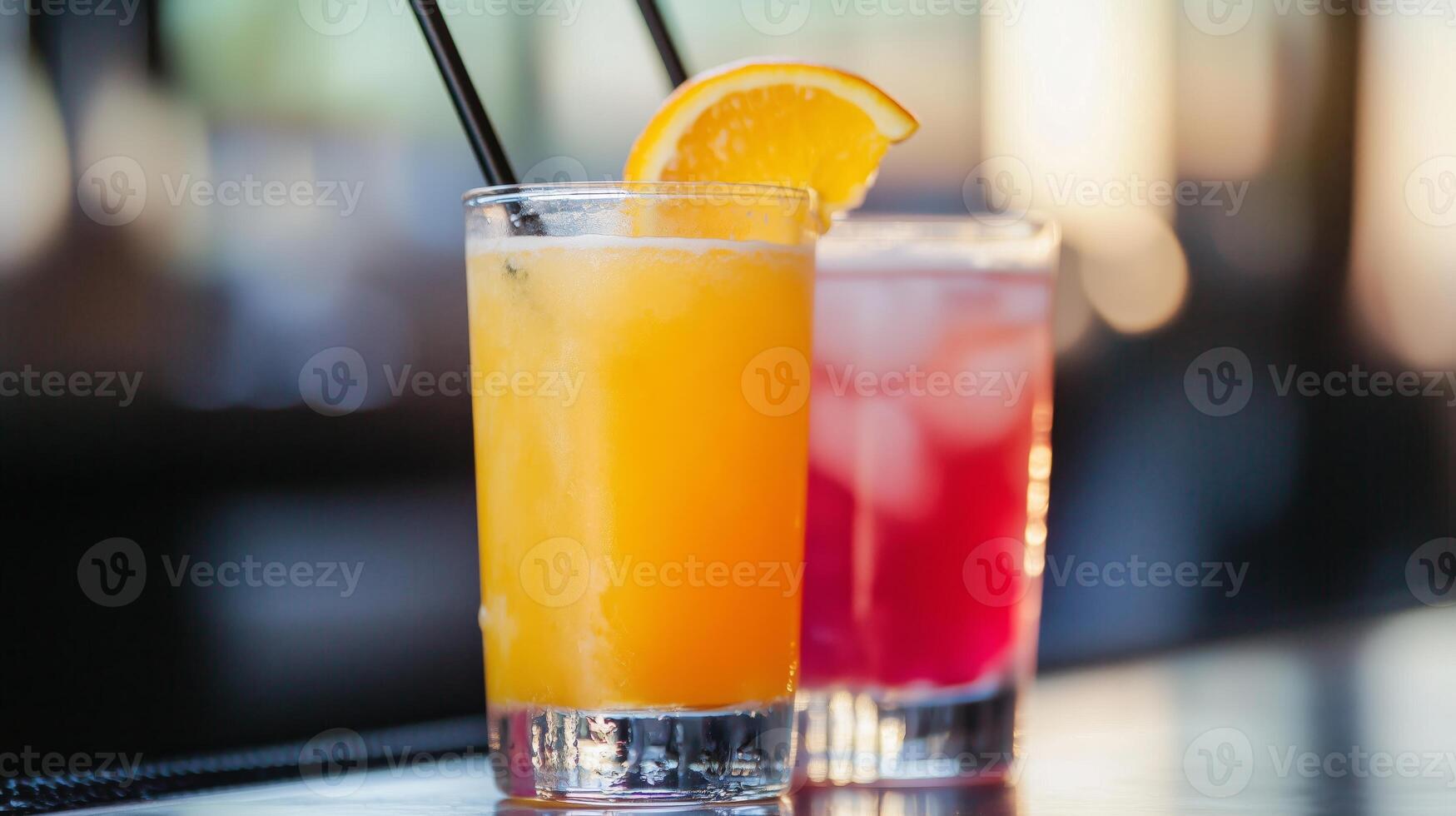 Two drinks with orange slices on a bar photo