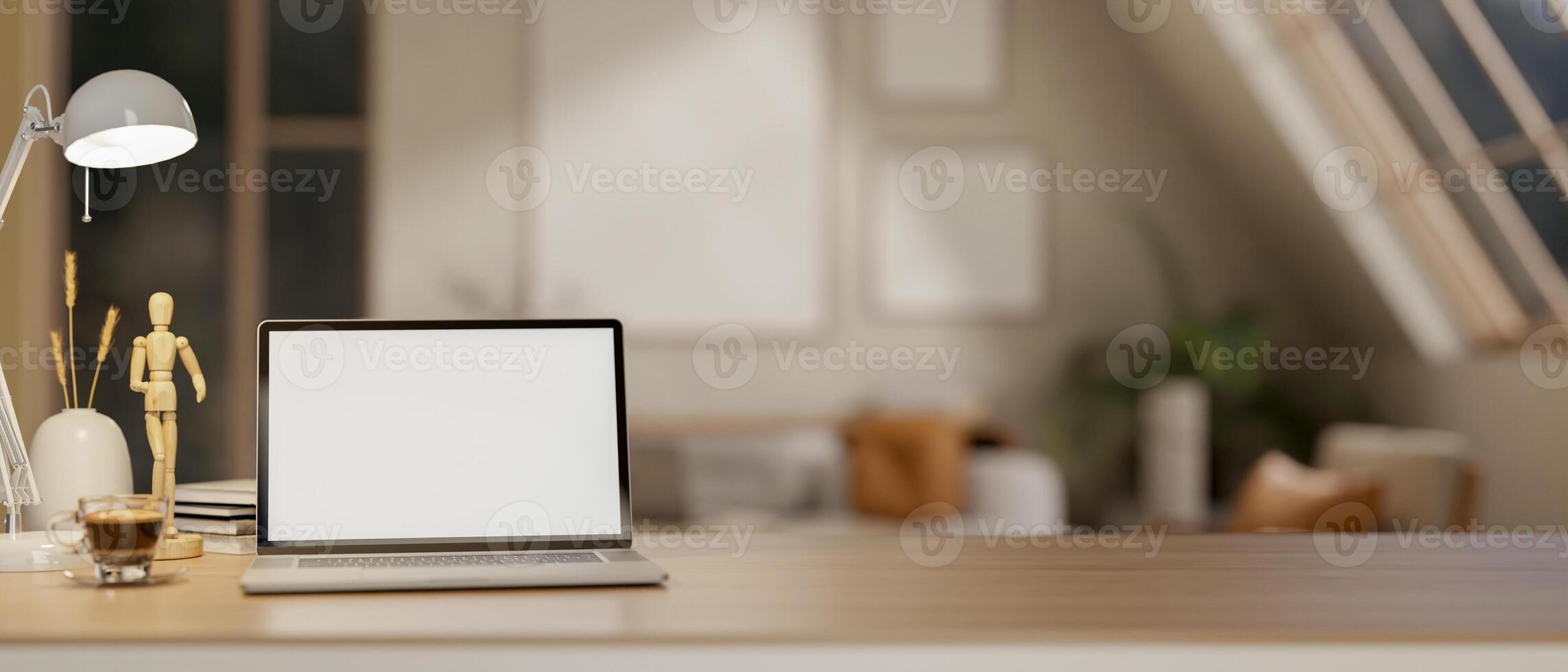 A white screen laptop on wooden table under the lamp light and moon light. Study or working at night. photo