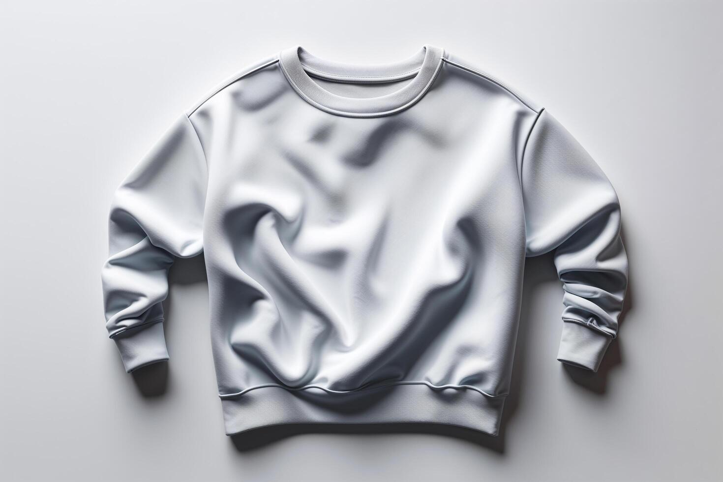 A white sweatshirt on a white surface photo