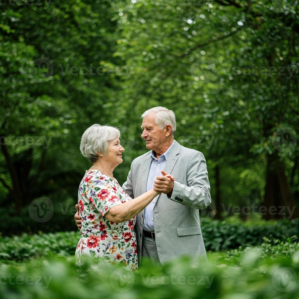 An older couple dancing in the woods photo