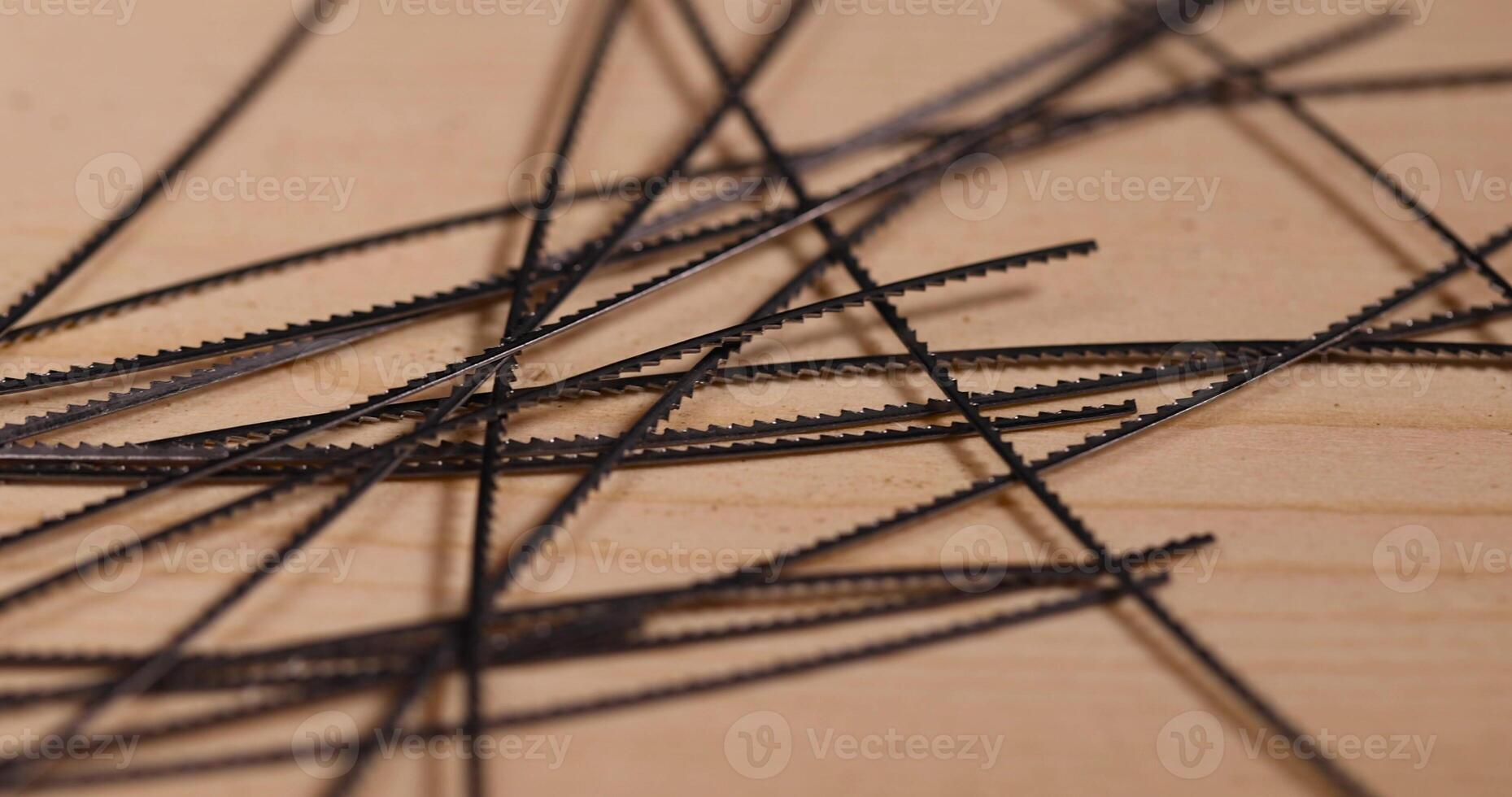 thin sharp metal wood saw blades, multiple metal brittle woodworking blades photo