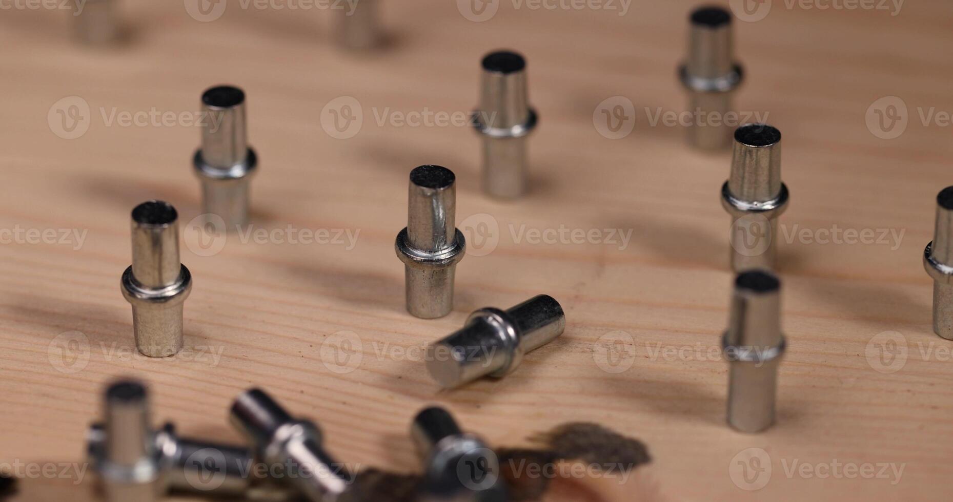 rivets for furniture to install shelves in cabinets, furniture fittings on a board photo