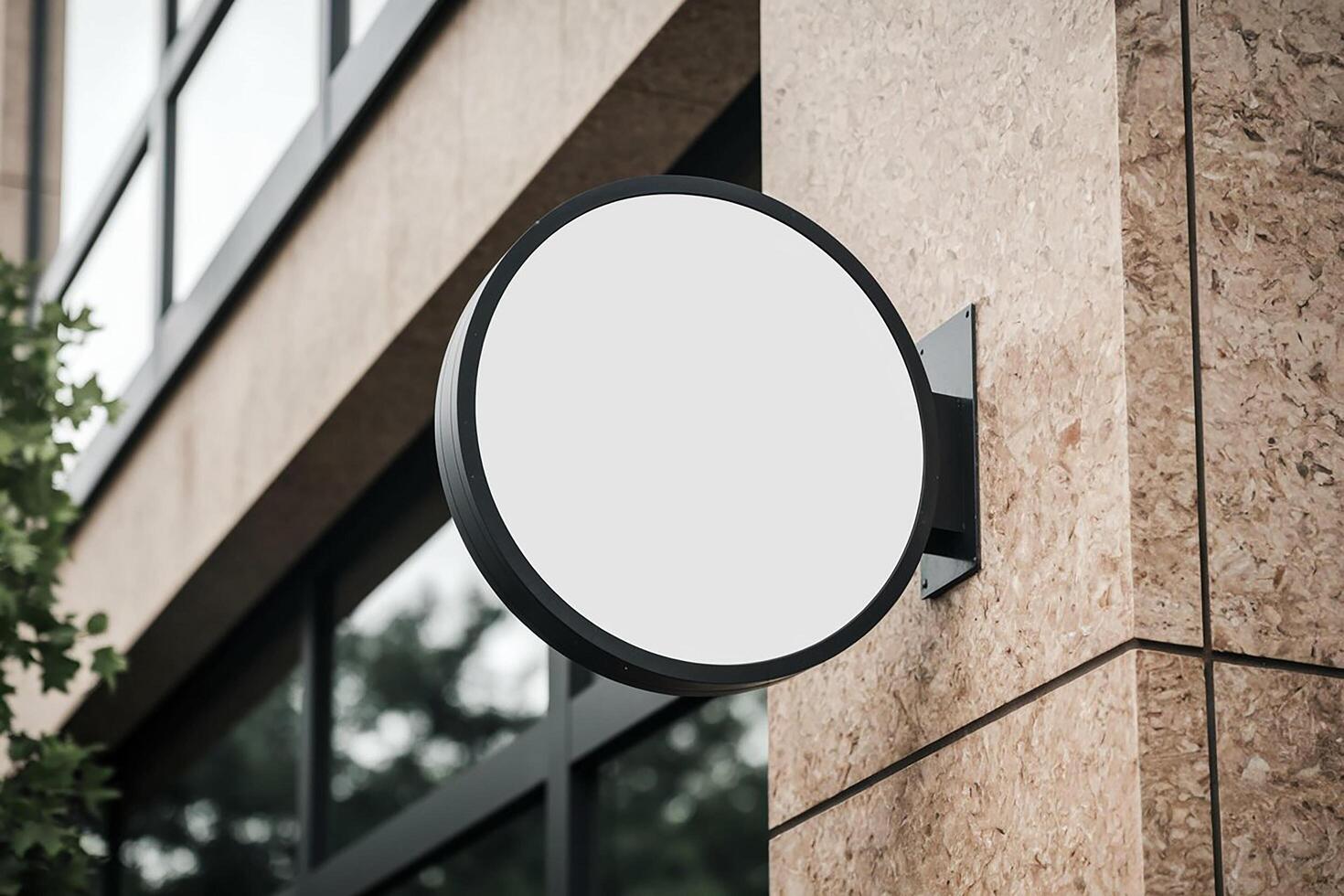 A white round sign on a building wall photo