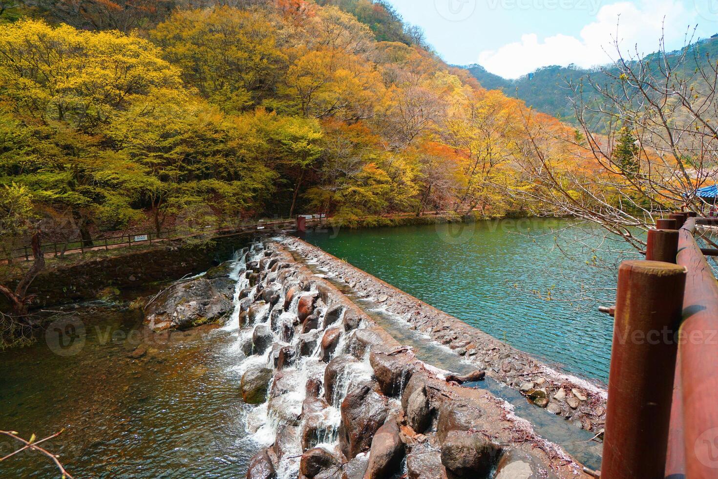 a waterfall in the middle of a river photo