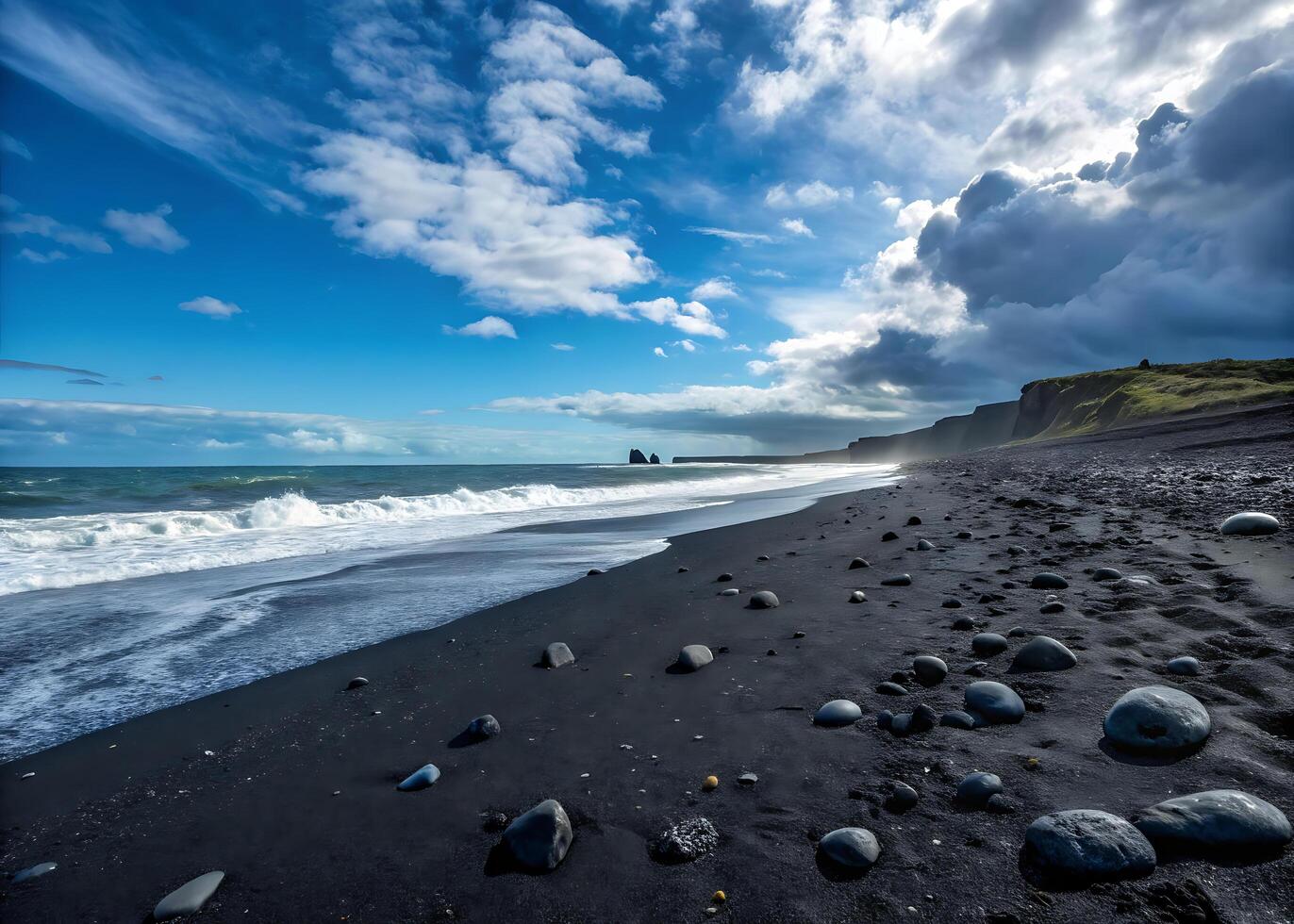 volcanic coast. Dramatic landscape of a volcanic black beach, where deep black sands contrast sharply with the bright blue sky photo