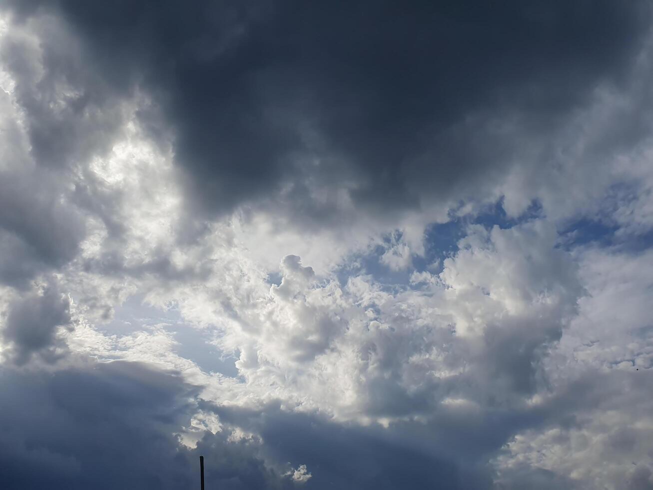 A gloomy rainy sky, covered with heavy clouds, creates an atmosphere of melancholy and comfort photo