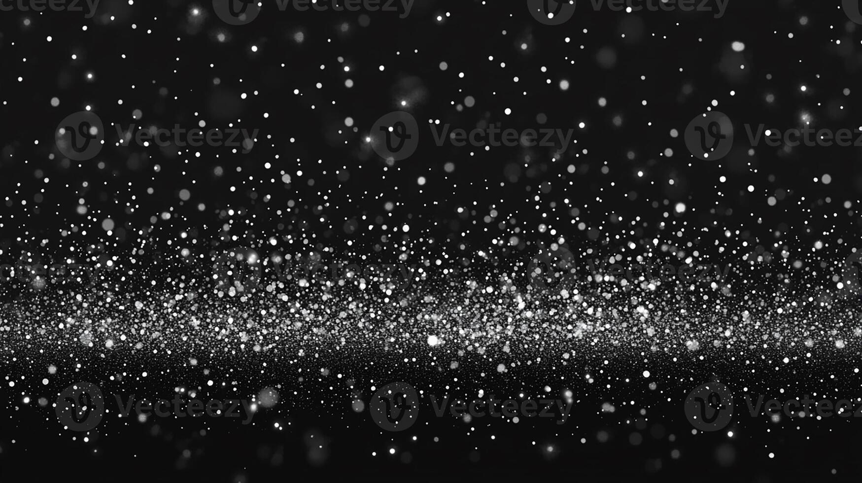 Snowflakes Falling Against a Black Background with Sparkling Bokeh photo