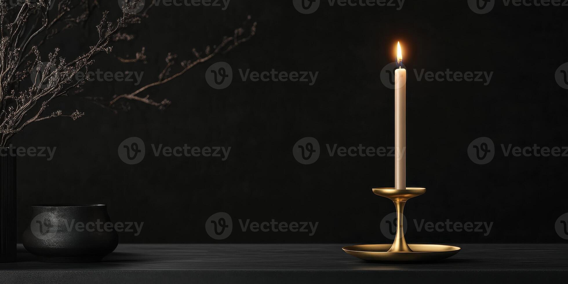 Elegant golden candlestick with burning candle on dark minimalist background photo