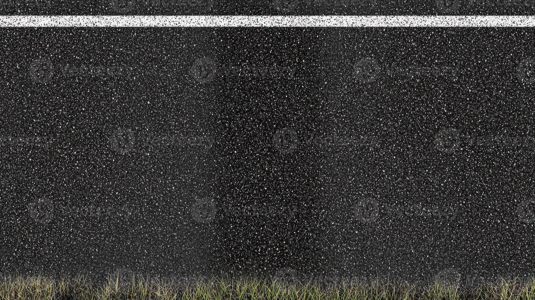 Asphalt road texture with grass edge and white line for background or design concept photo