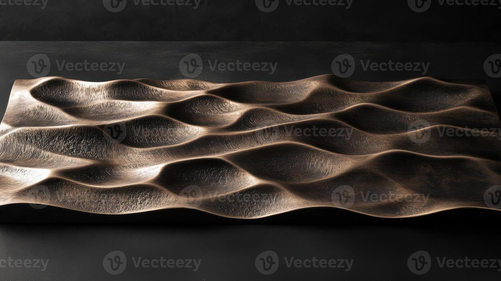 Textured bronze sculpture with elegant wave pattern for modern interior design concept photo