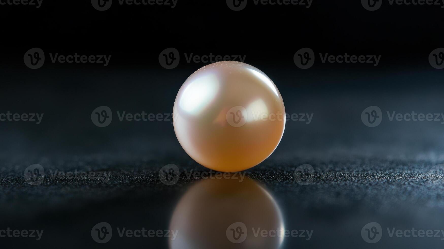 Close-up of a lustrous pearl on dark surface reflecting light highlighting elegance photo