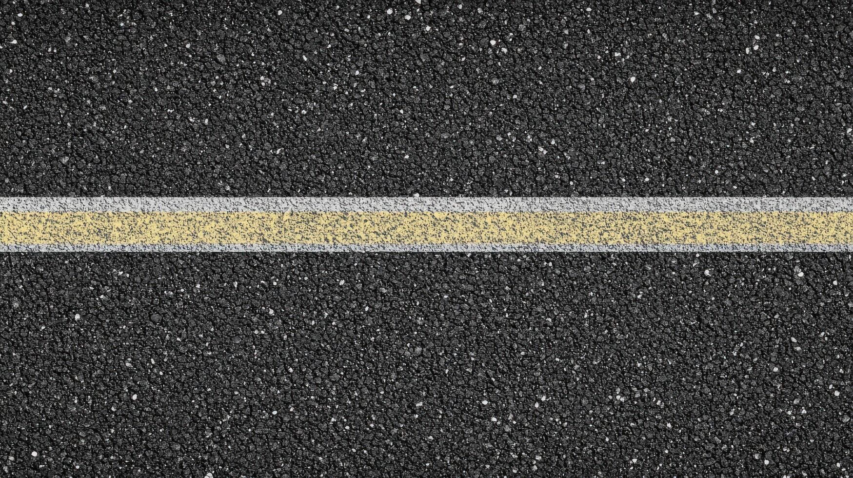 Close-up of asphalt road with yellow and white lines abstract texture concept photo