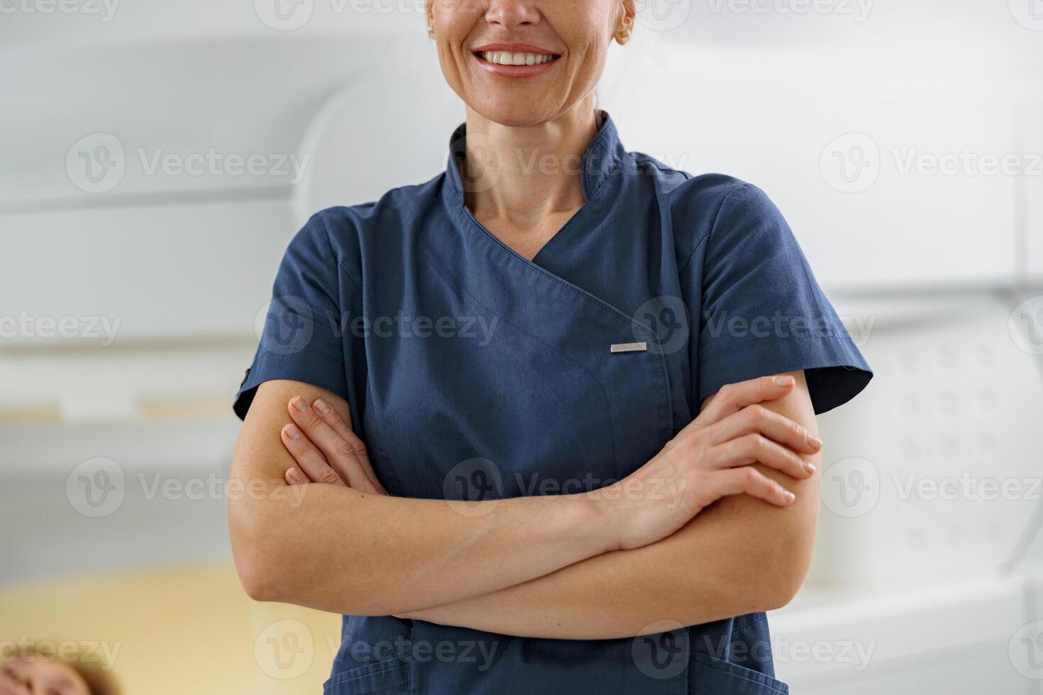 Close up of doctor radiologist on background of MRI or CT Scan with patient undergoing procedure photo
