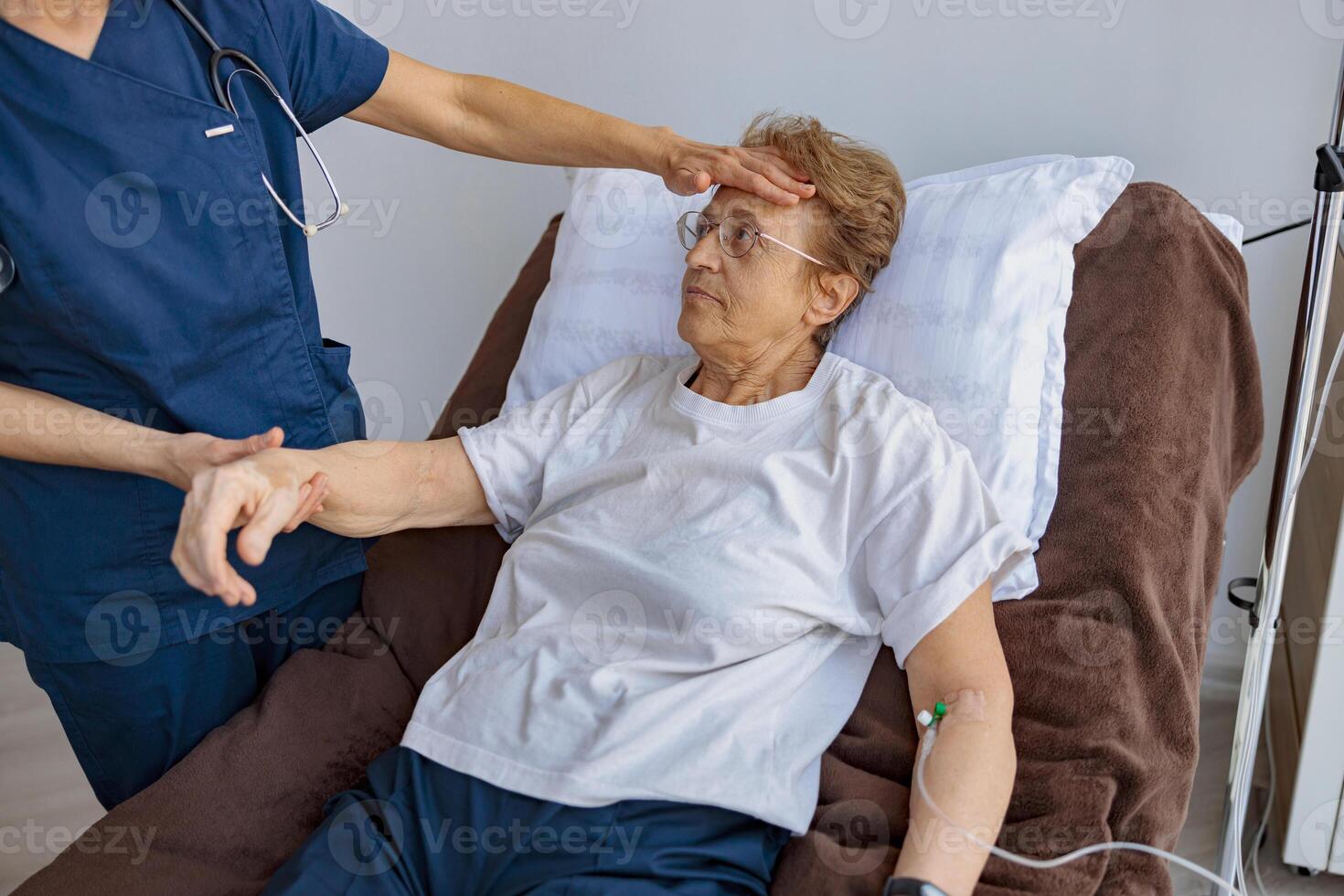 Doctor control temperature of sick female patient in hospital ward in clinic photo