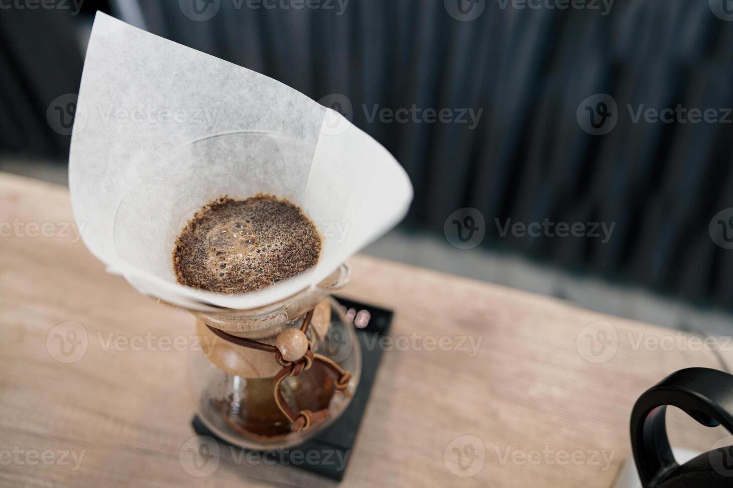 Alternative brewing of coffee in paper filter close up photo
