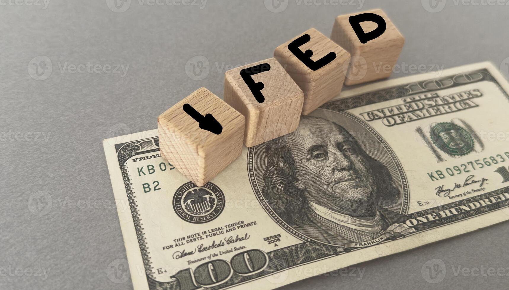 Wooden cubes with FED and up-down arrows over 100 usd. Fed rate hike concept to curb inflation photo