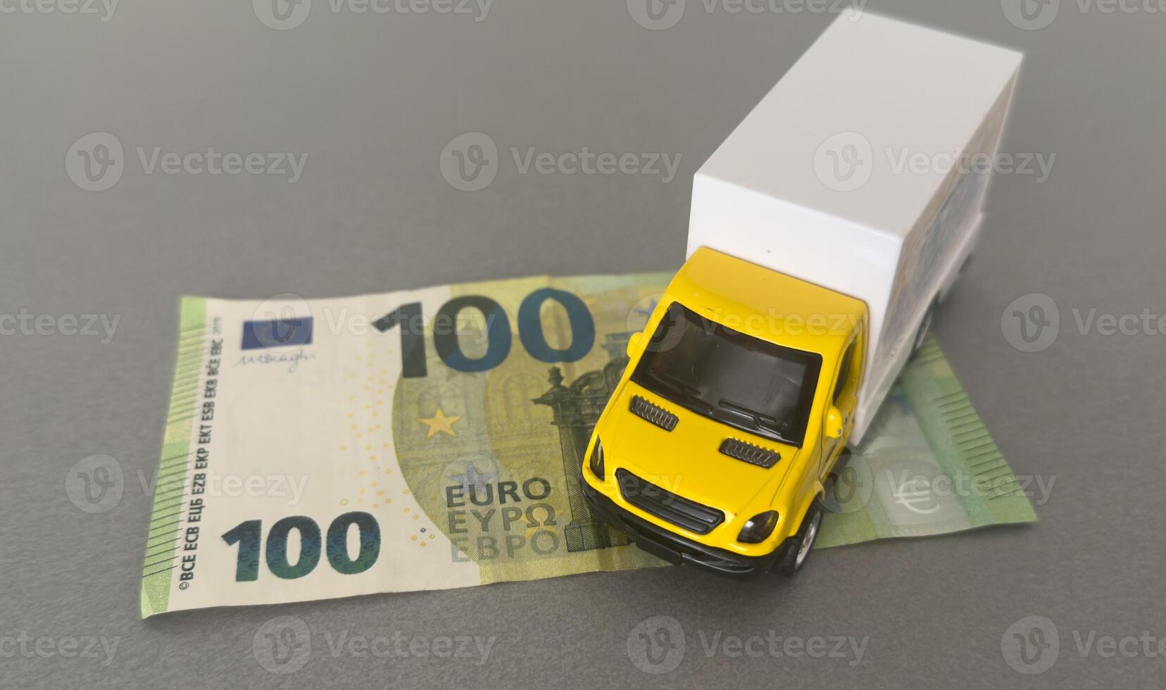 The truck on euro bills. Concept of an insurance contract for new trucks or expensive fuel photo