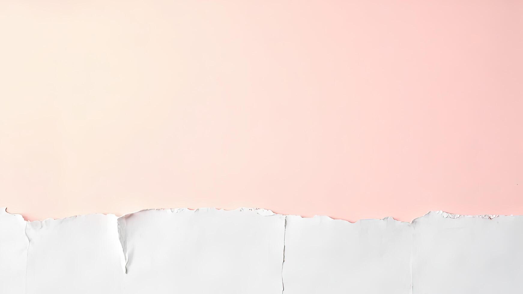 A white paper torn into pieces on a pink background photo