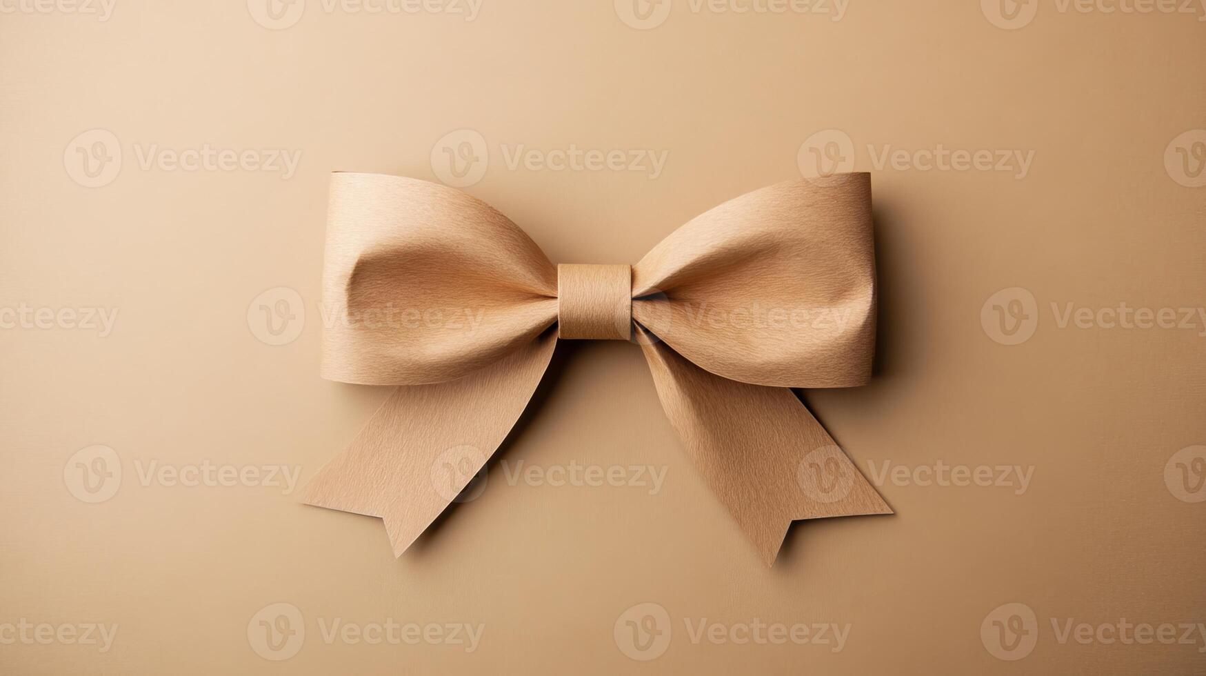 Elegant beige bow on a matching beige background, minimalistic and stylish photo