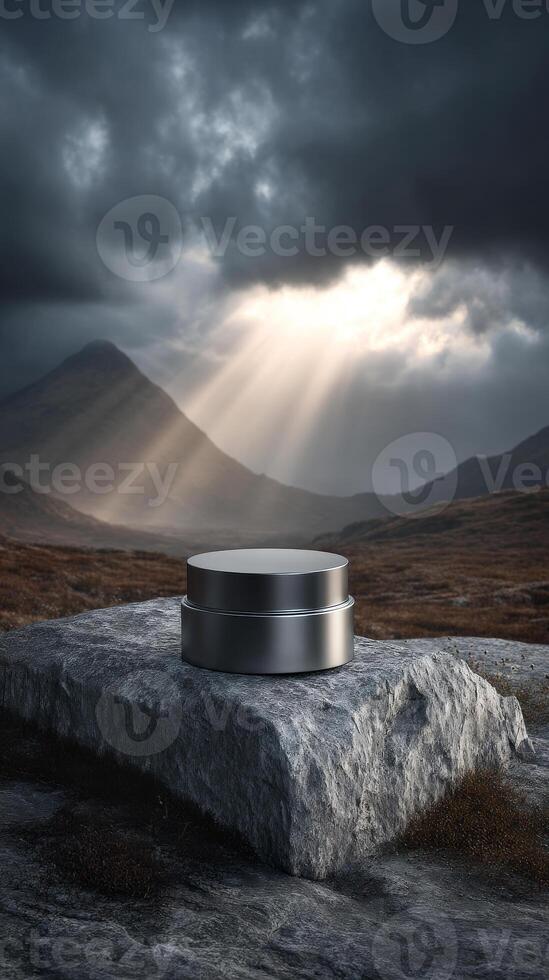 Dramatic mountain scene with metal cream jar on rock, concept of mystery object photo
