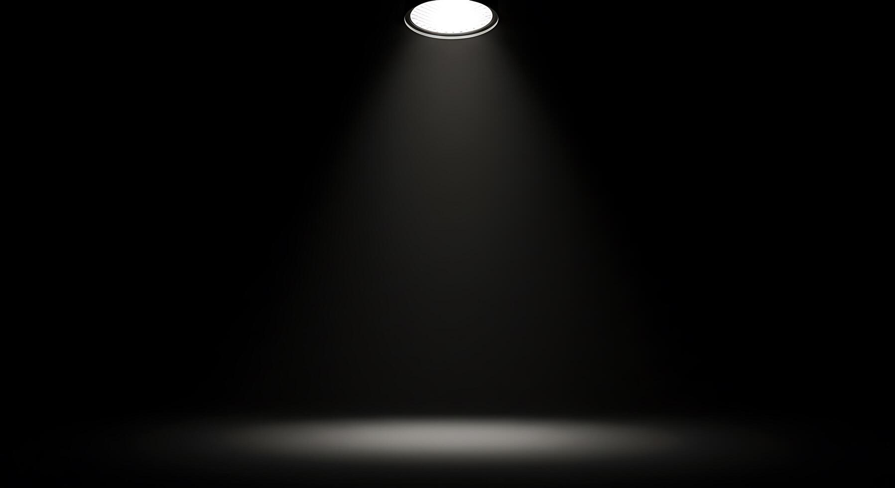 A spotlight is shining on a black background photo