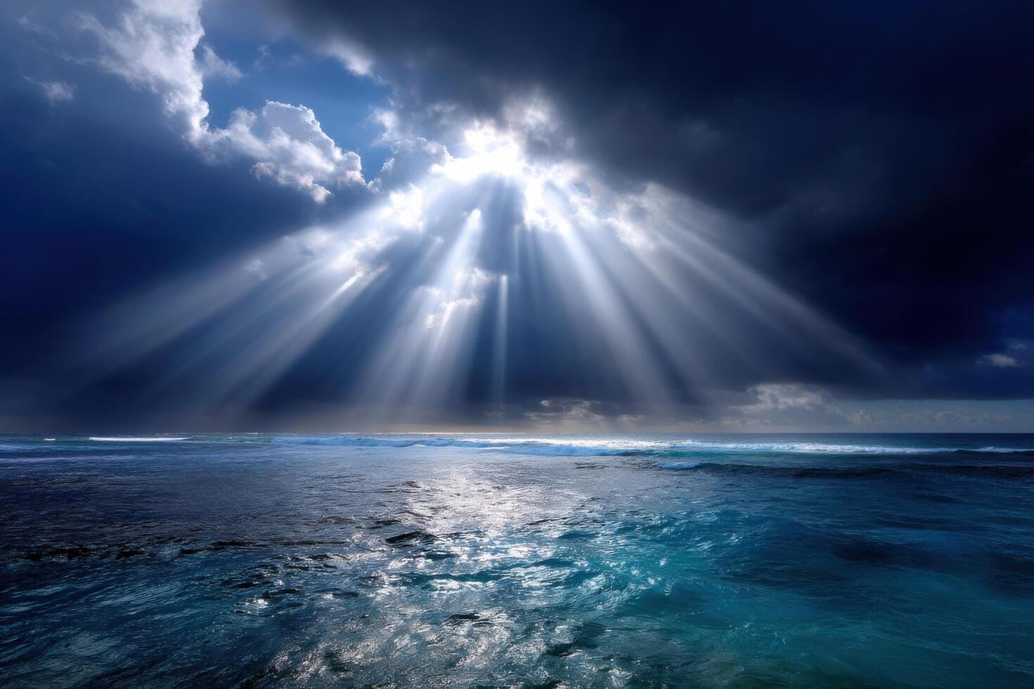 Awe Inspiring Sunbeams Piercing Through Dramatic Clouds Over the Ocean photo