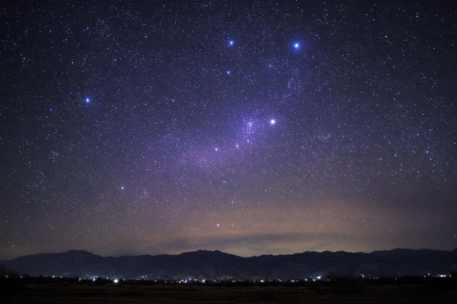 Starry Night Sky Over Mountains A Breathtaking Celestial View photo