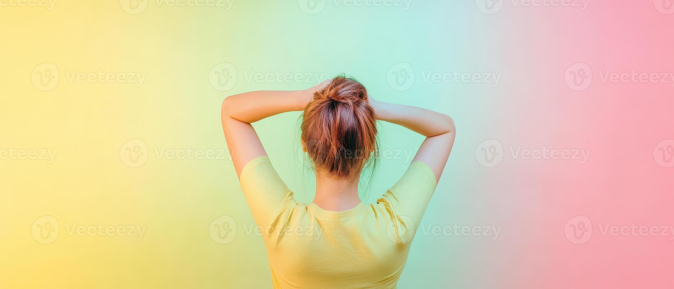 Young woman relaxes arms behind head photo
