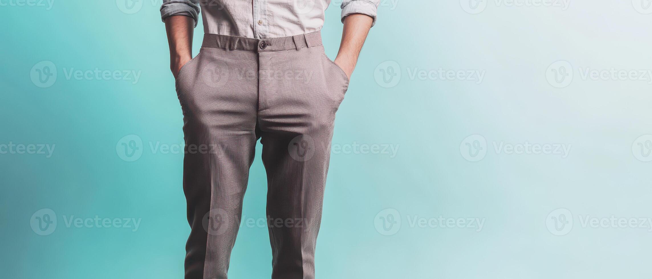Stylish man poses confidently in tailored pants photo