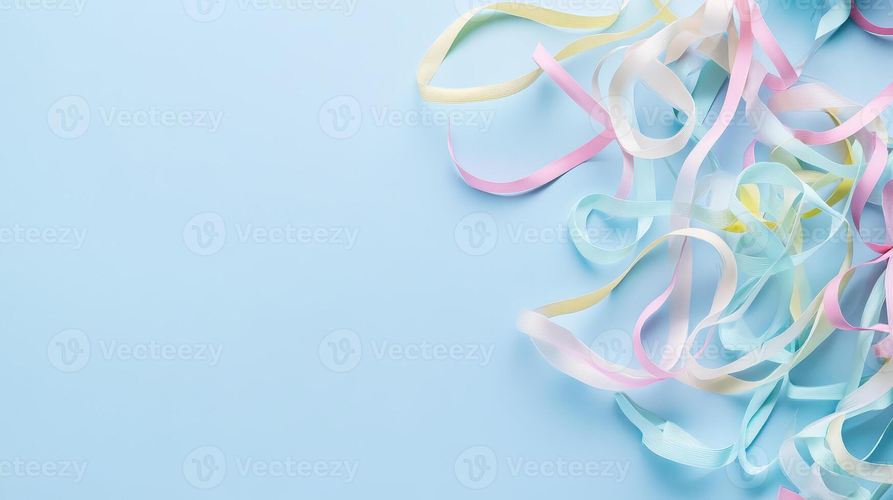Colorful streamers on blue backdrop photo