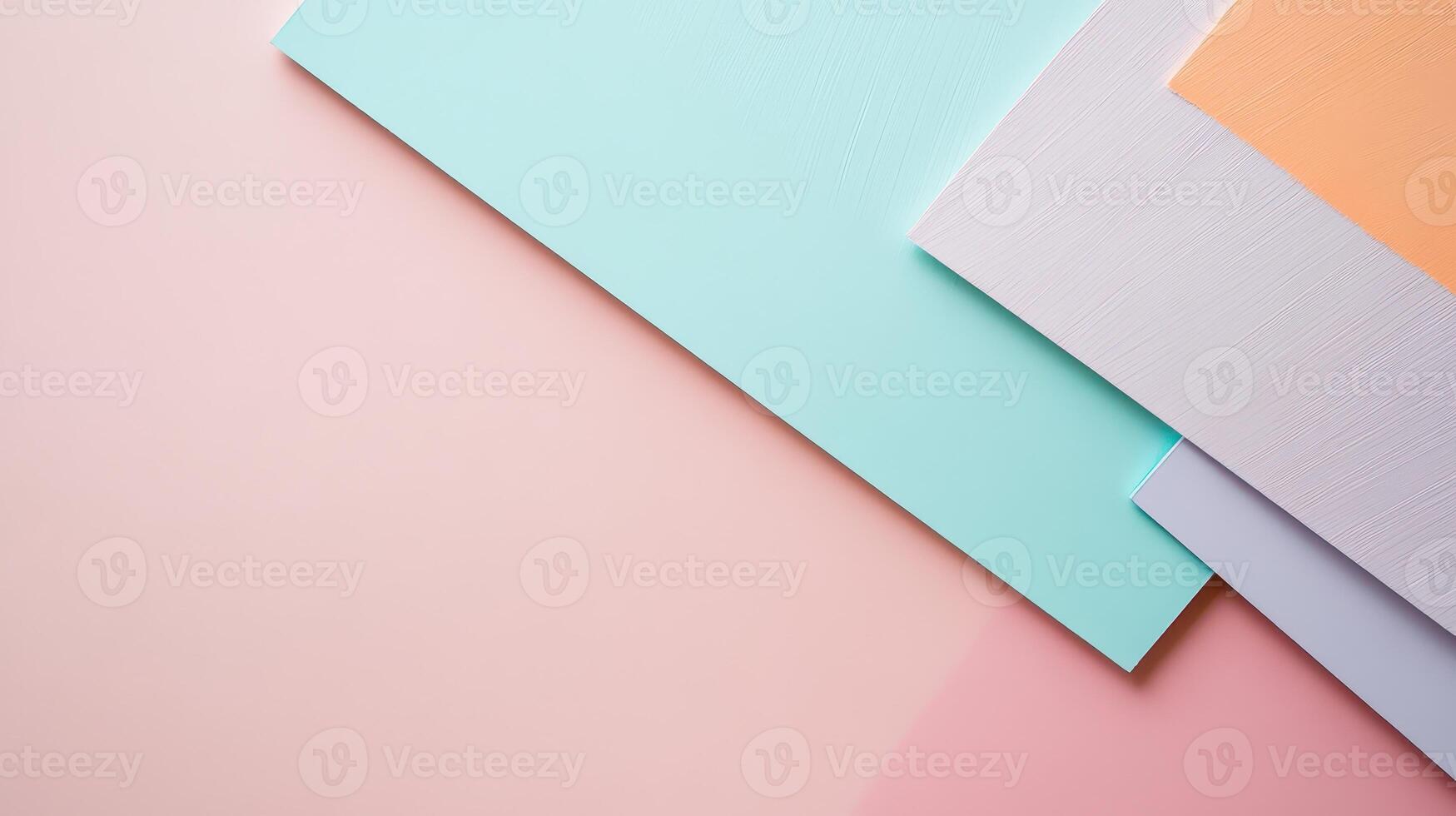 Colorful paper sheets on pastel backdrop photo