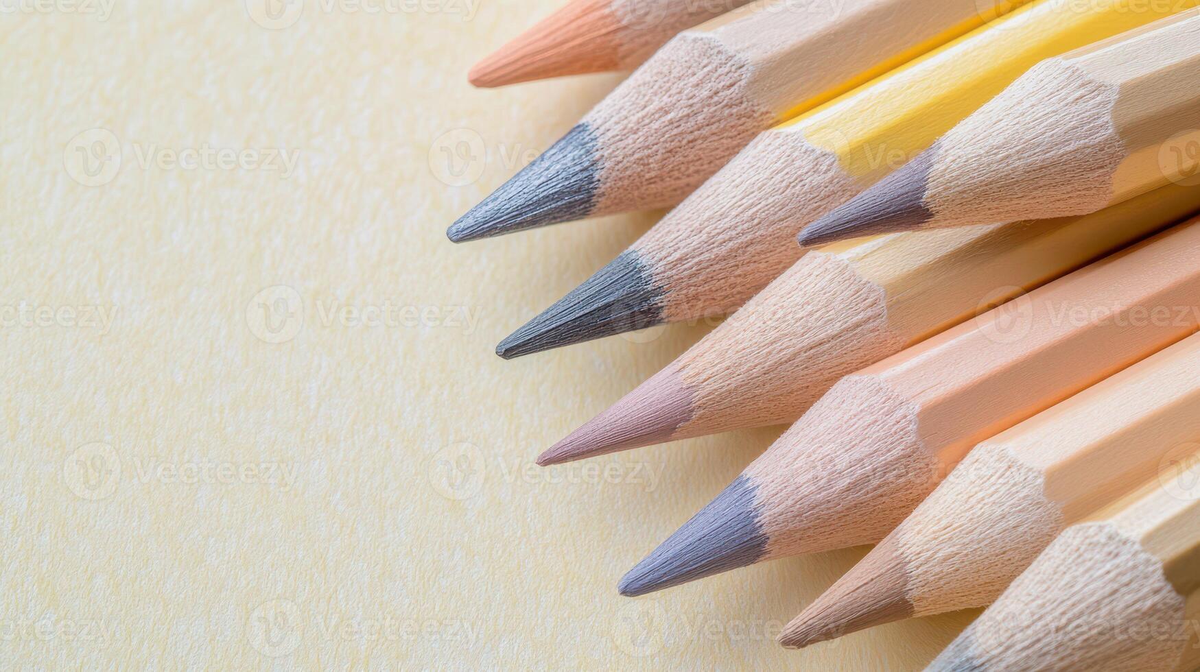 Variety of colored pencils arranged on a surface photo