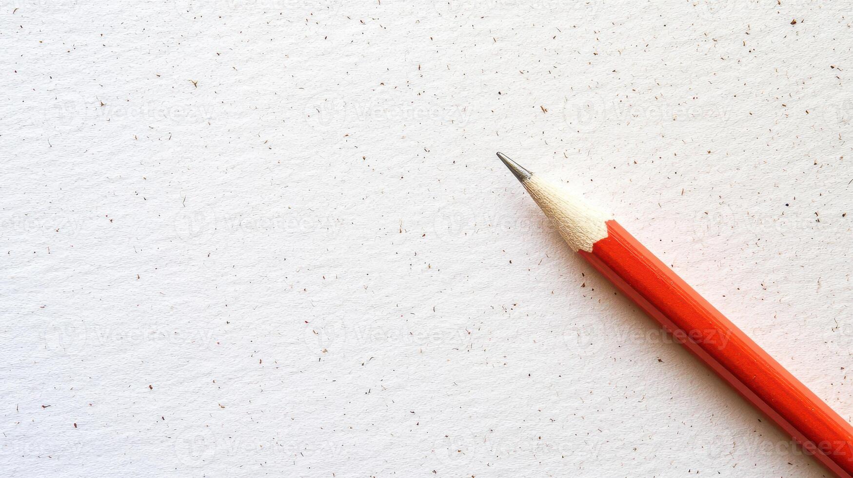 Drawing instrument beside blank textured paper photo